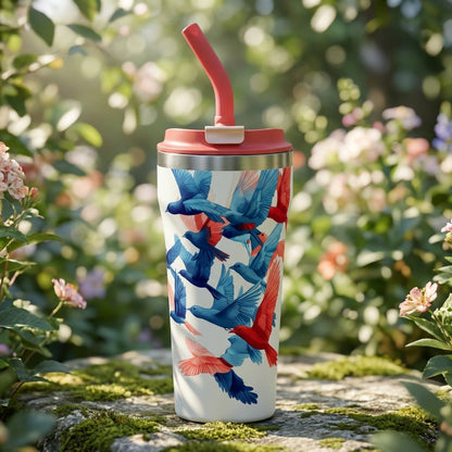 Cream colored 16oz insulated tumbler featuring a pattern of blue and red birds in flight with a light red lid and straw.