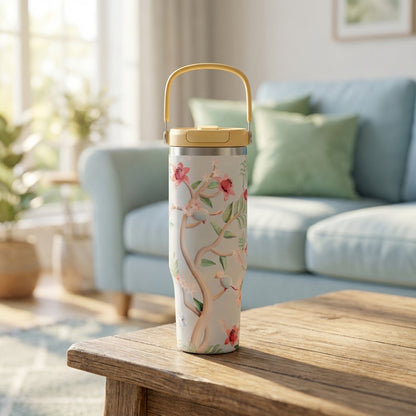 LAMOSE Cascade 40 oz tumbler in cream with vintage red floral and bird pattern, featuring a pale yellow handle and flip lid.
