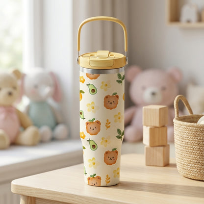 LAMOSE Cascade 40 oz tumbler in cream with cute cartoon bear faces, avocados, and yellow flowers, featuring a yellow flip lid and handle.