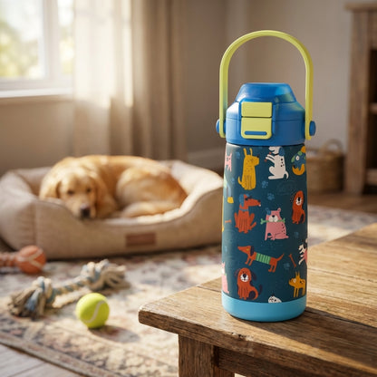 Blue LAMOSE Goose 14oz kids water bottle featuring colorful dog illustrations, paw prints, and 'WOOF' text standing on a wooden surface.