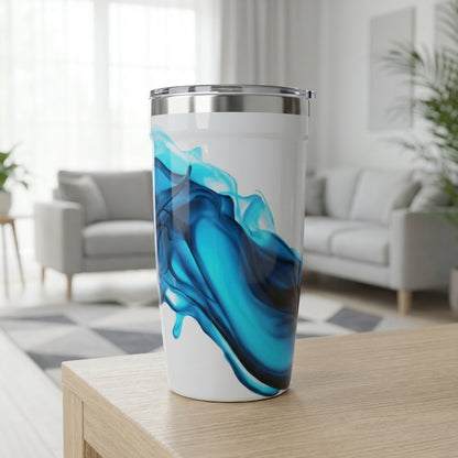 LAMOSE Peyto 16 oz white travel cup featuring a deep blue abstract ink swirl design, standing on a textured surface.