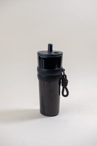 black stainless steel straw tumbler featuring a BPA-free plastic straw and black rubber grip bands, complete with a convenient carrying rope, perfect for on-the-go hydration. 