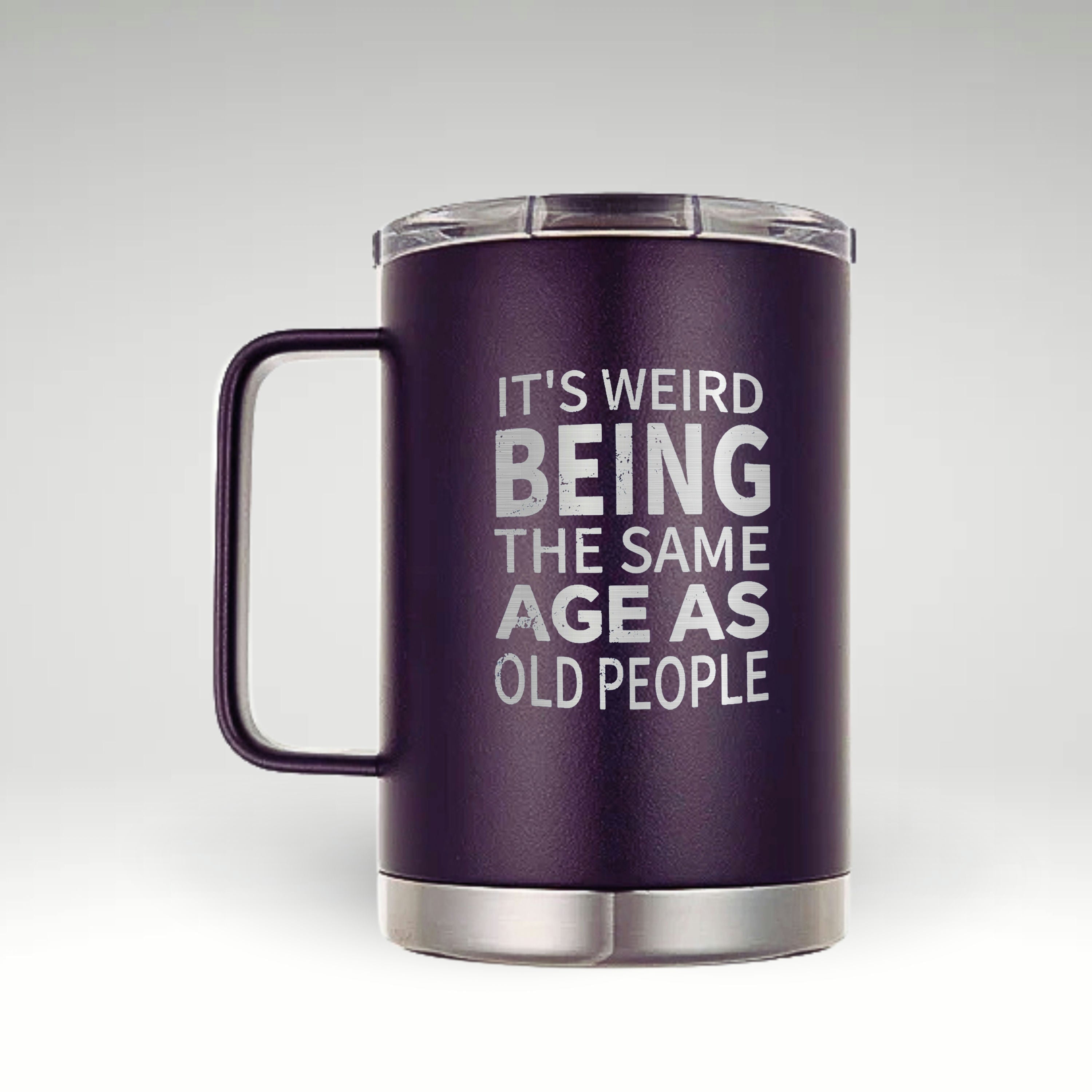 Aging with Humor: Insulated Mug Navy blue insulated mug with white text 'IT'S WEIRD BEING THE SAME AGE AS OLD PEOPLE' 