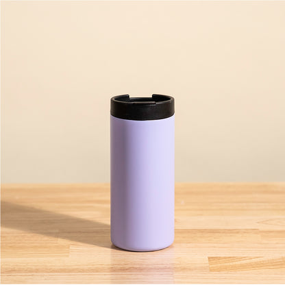 LAMOSE Grouse 12 oz insulated tumbler in pastel purple, standing upright on a wood table, showing its black lid and sleek design.