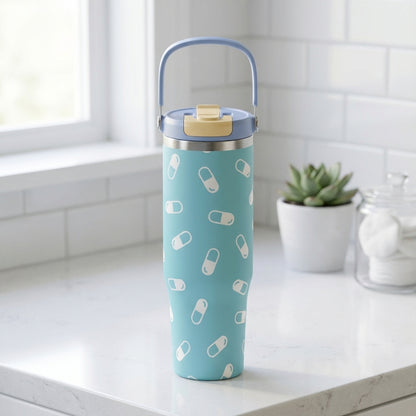 Light blue Cascade 40oz tumbler featuring a playful white medical pill pattern, standing on a clean surface.