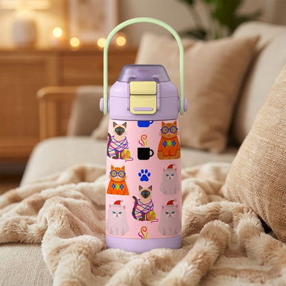 LAMOSE Goose 14oz light pink water bottle featuring cartoon cats in Santa hats, coffee cups, and yarn on a textured tan blanket.