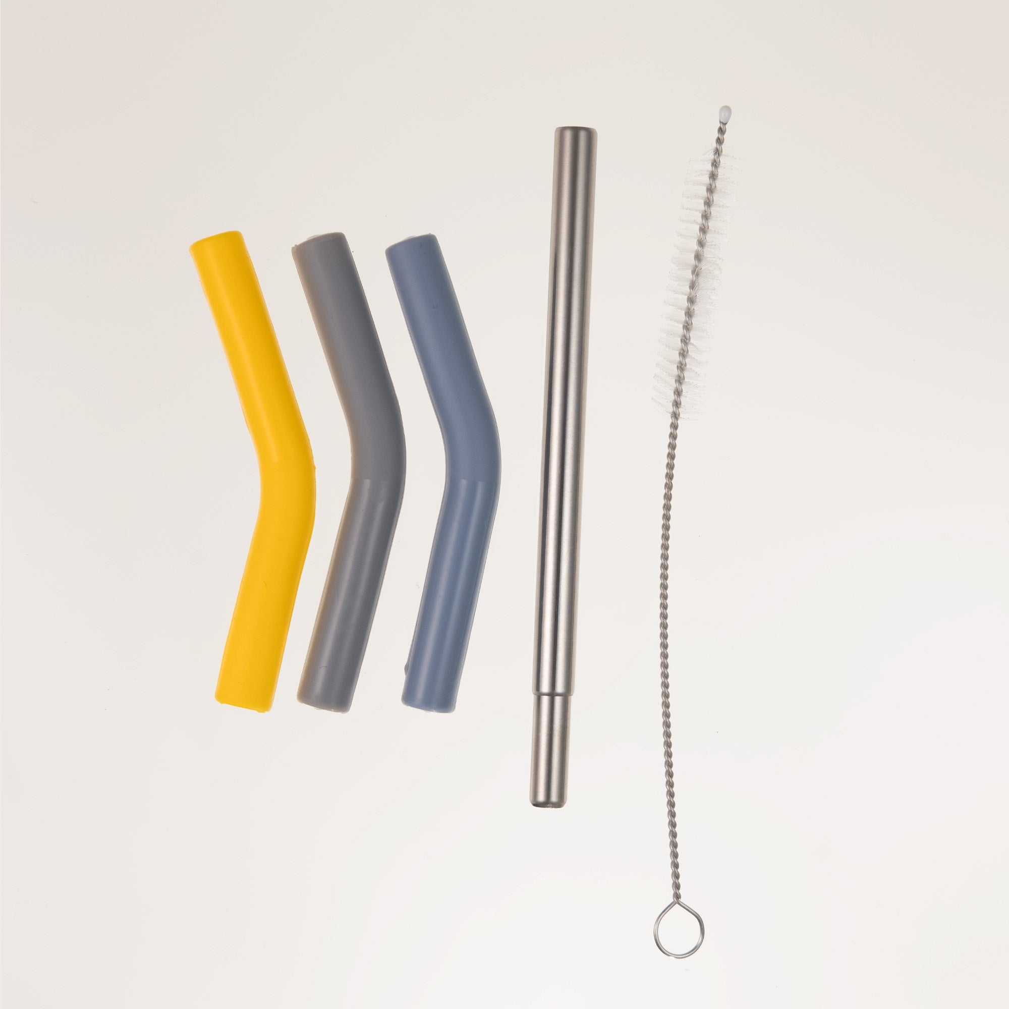 LAMOSE reusable straw set with yellow, gray, blue bent silicone tips, a straight stainless steel straw, and a cleaning brush. Overhead view.