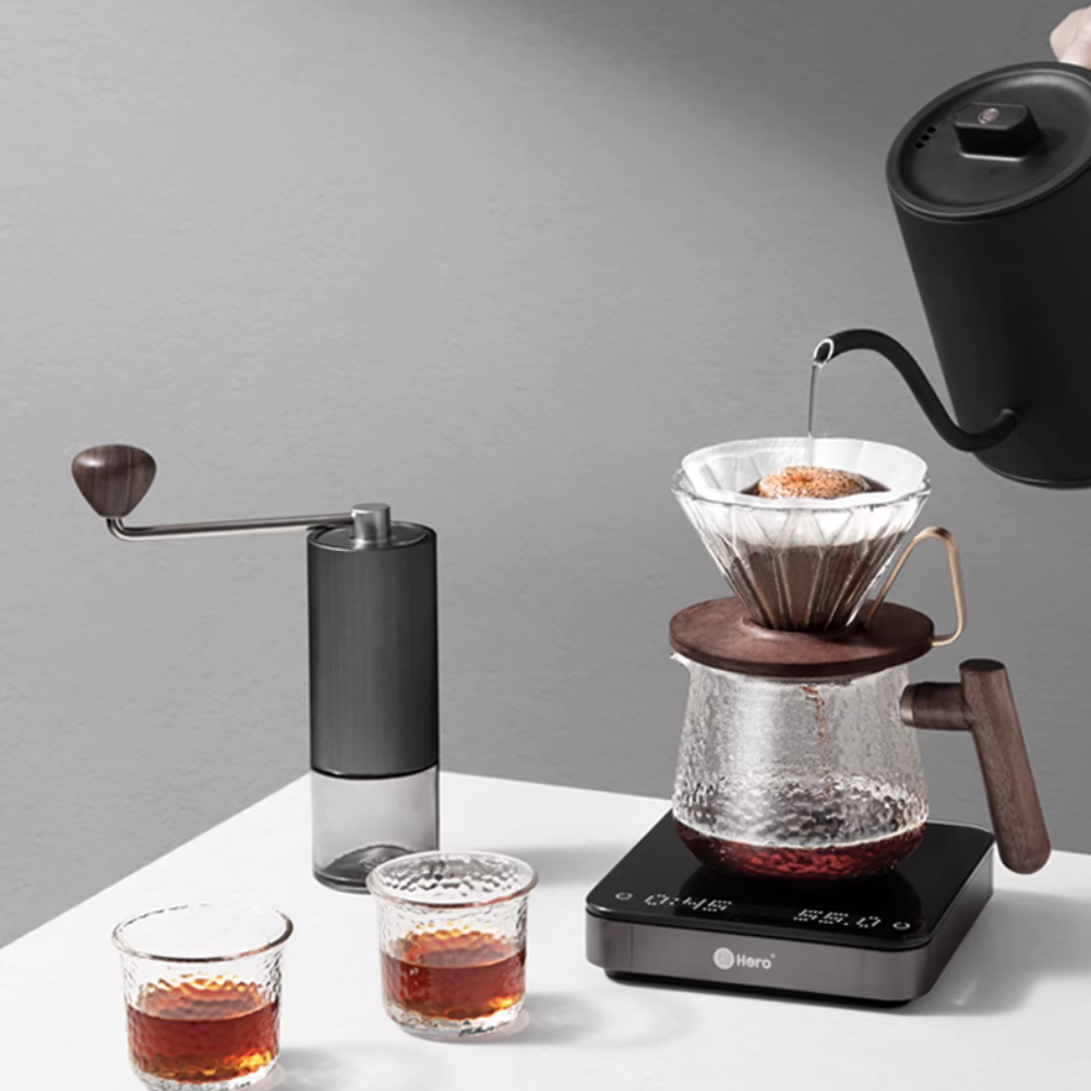 LAMOSE zeroHero Walnut Prisma Dripper pour-over coffee set with manual grinder, smart scale, kettle, two glasses on white. Brewing.