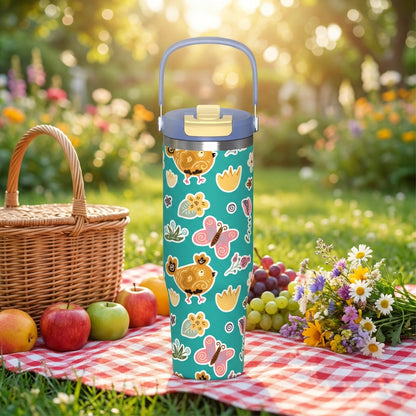 LAMOSE Cascade 40 oz tumbler in teal featuring stylized gold and pink chickens, butterflies, and floral patterns sitting on a picnic blanket.