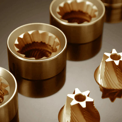 LAMOSE zeroHero Z3 Pro precision golden titanium-coated coffee grinder burrs, showcasing both outer ring and conical inner burr designs from an elevated angle.