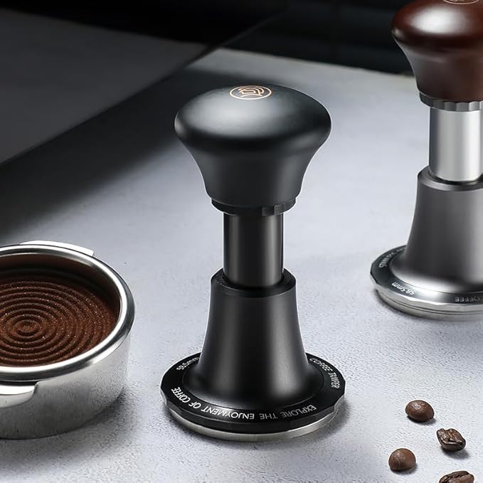 Premium adjustable espresso tamper with ergonomic black handle, stainless steel base, and precision leveling design for even coffee puck compression.