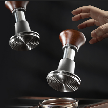  Adjustable espresso tamper with ergonomic wooden handle and spiral-textured stainless steel base, designed for even coffee puck compression and precise extraction.