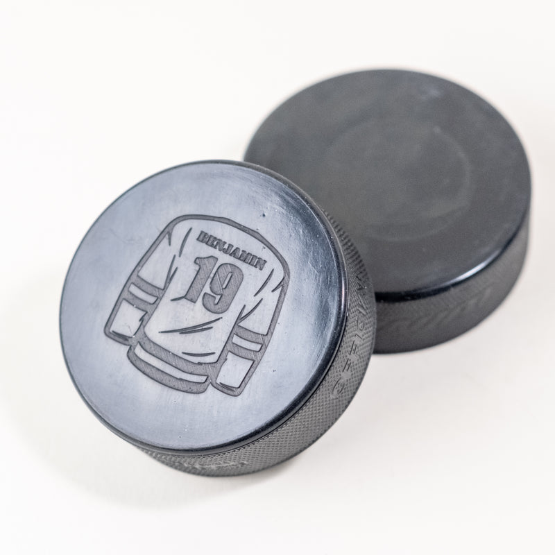 Custom laser engraved hockey puck with jersey design