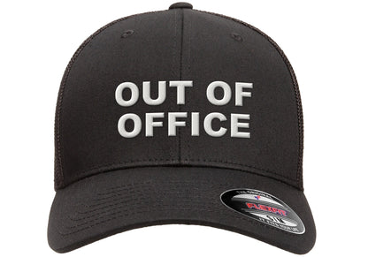 Black Flexfit trucker mesh cap with OUT OF OFFICE embroidered in white on the front