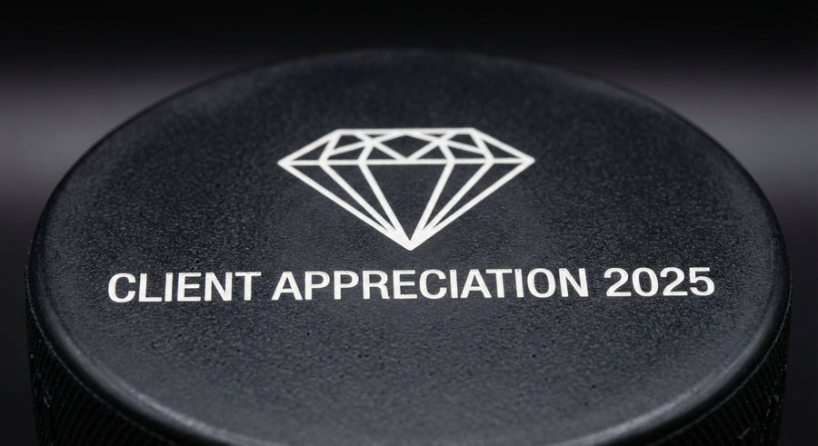 Close-up corporate logo Client Appreciation 2025 laser engraved on puck