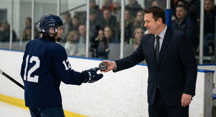 Tournament podium captain receiving laser engraved hockey puck prize