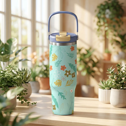 LAMOSE Cascade 40 oz insulated tumbler featuring a teal background with orange, brown, and white floral 5D print, standing on a wooden surface.