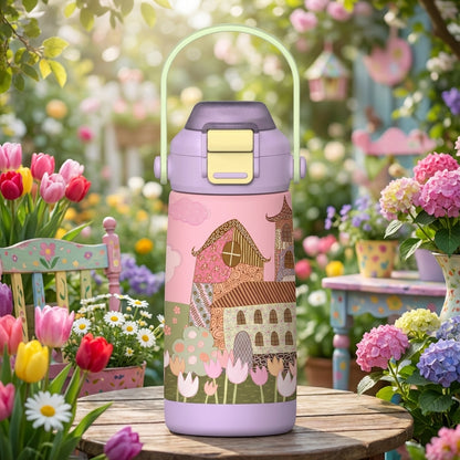 Pink LAMOSE Goose 14 oz kids water bottle featuring a whimsical fairytale house illustration resting on a wooden garden table surrounded by flowers.