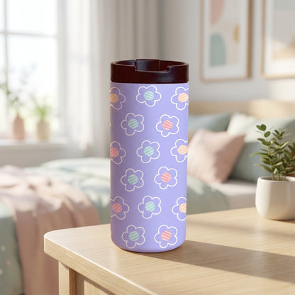 LAMOSE Grouse 12oz tumbler in lavender featuring white floral outlines with pink, blue, and yellow striped centers, sitting on a light wooden table with a dark brown lid.