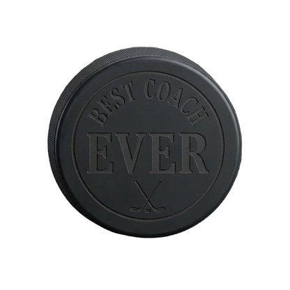 "Best Coach Ever" Engraved Hockey Puck — laser-engraved hockey puck, tonal black-on-black engraving on vulcanized rubber, made in Calgary