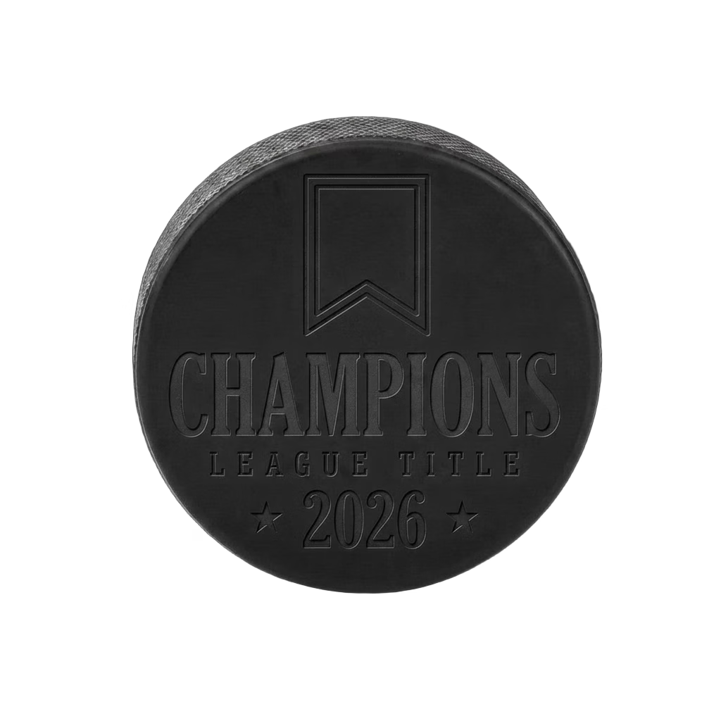 "Champions League Title 2026" Engraved Hockey Puck — laser-engraved hockey puck, tonal black-on-black engraving on vulcanized rubber, made in Calgary