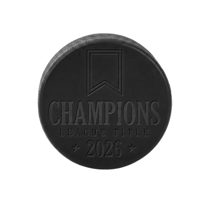 "Champions League Title 2026" Engraved Hockey Puck — laser-engraved hockey puck, tonal black-on-black engraving on vulcanized rubber, made in Calgary
