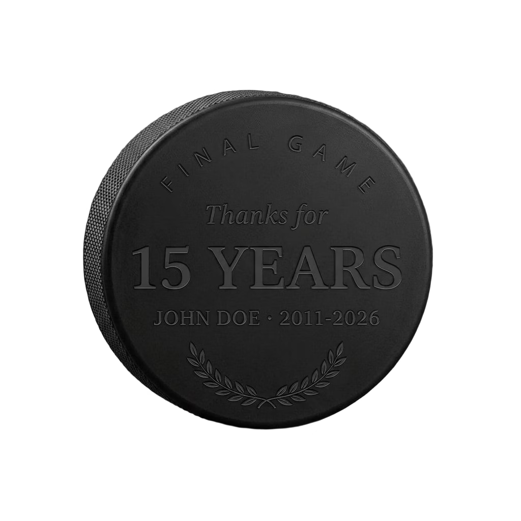 "Final Game · Thanks for the Years" Retirement Hockey Puck — laser-engraved hockey puck, tonal black-on-black engraving on vulcanized rubber, made in Calgary
