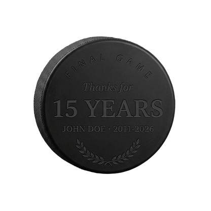 "Final Game · Thanks for the Years" Retirement Hockey Puck — laser-engraved hockey puck, tonal black-on-black engraving on vulcanized rubber, made in Calgary