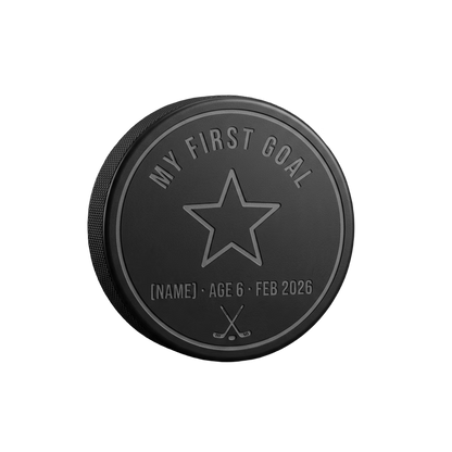 "My First Goal" Milestone Engraved Hockey Puck — laser-engraved hockey puck, tonal black-on-black engraving on vulcanized rubber, made in Calgary