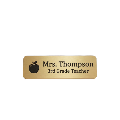 Teacher / School Staff Name Tag — Classroom & Conference Ready — LAMOSE custom laser-engraved professional name tag, Trotec Trolase two-layer acrylic laminate (1.5 × 3 in.) in Brushed Gold with Black engraving, made in Calgary, Canada since 2017.