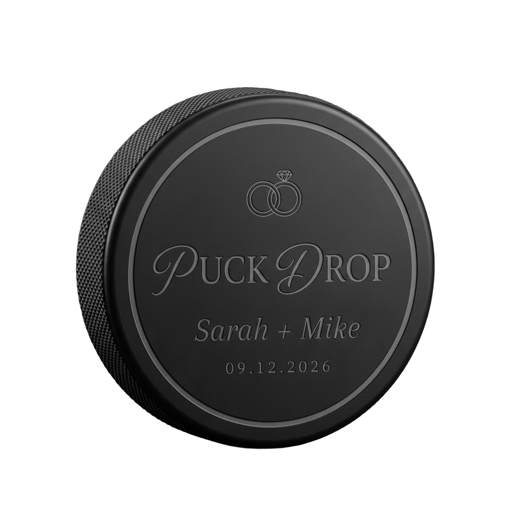 "Puck Drop" Wedding Favor Engraved Hockey Puck — laser-engraved hockey puck, tonal black-on-black engraving on vulcanized rubber, made in Calgary