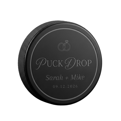 "Puck Drop" Wedding Favor Engraved Hockey Puck — laser-engraved hockey puck, tonal black-on-black engraving on vulcanized rubber, made in Calgary