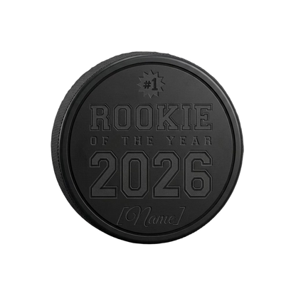 "Rookie of the Year" Engraved Hockey Puck Award — laser-engraved hockey puck, tonal black-on-black engraving on vulcanized rubber, made in Calgary