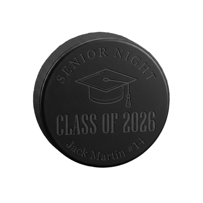 "Senior Night Class of 2026" Engraved Hockey Puck — laser-engraved hockey puck, tonal black-on-black engraving on vulcanized rubber, made in Calgary