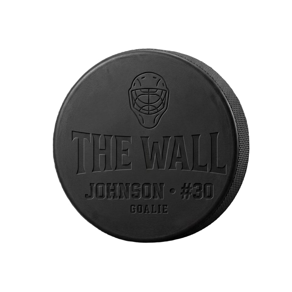 "The Wall" Goalie Engraved Hockey Puck — laser-engraved hockey puck, tonal black-on-black engraving on vulcanized rubber, made in Calgary