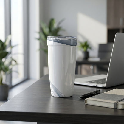 Peyto 16 oz white tumbler with subtle gray wave lines sitting on a modern office desk next to a laptop and plant.