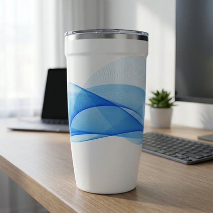 White 16oz insulated travel cup featuring abstract blue wavy line art design sitting on a modern office desk