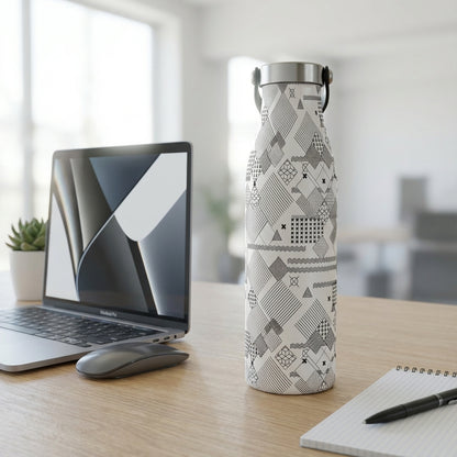 White LAMOSE Robson 21 oz insulated water bottle featuring black geometric doodle patterns sitting on a minimalist wooden desk next to a laptop and succulent.