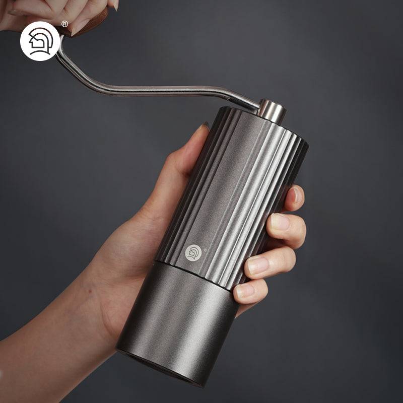 LAMOSE ZeroHero Z3 Pro hand coffee grinder in dark grey aluminum. Features an ergonomic wood handle and stainless steel crank.